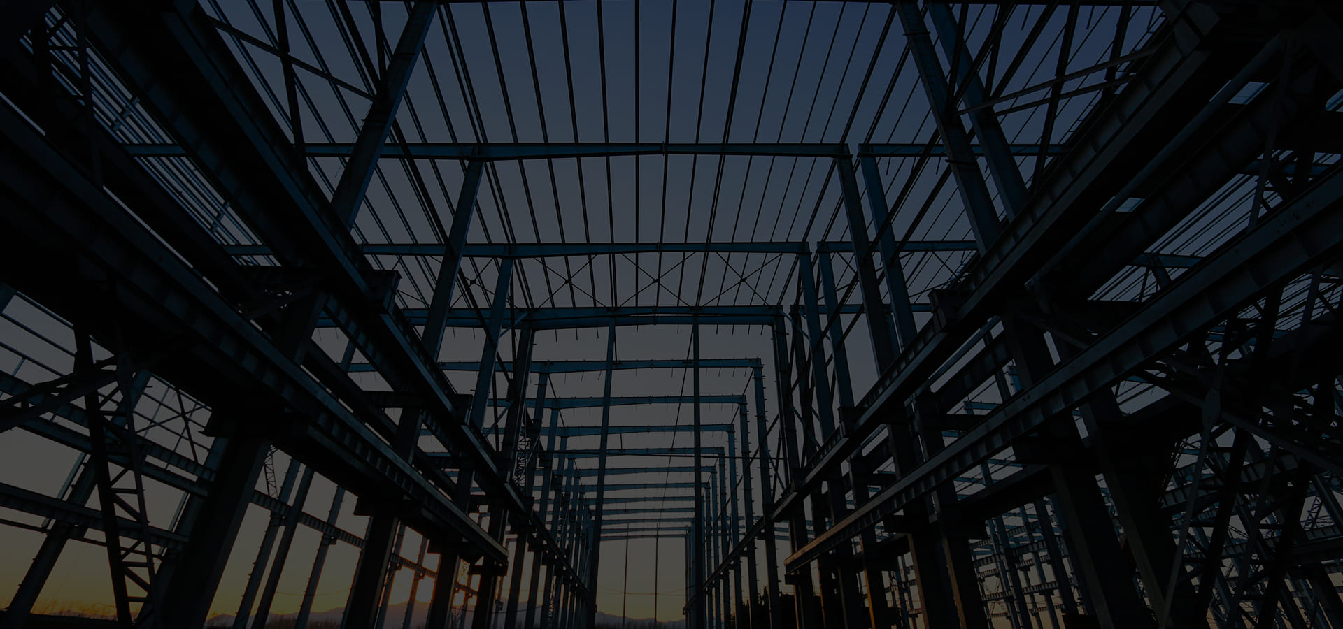 Steel structure frame seen from below at dusk